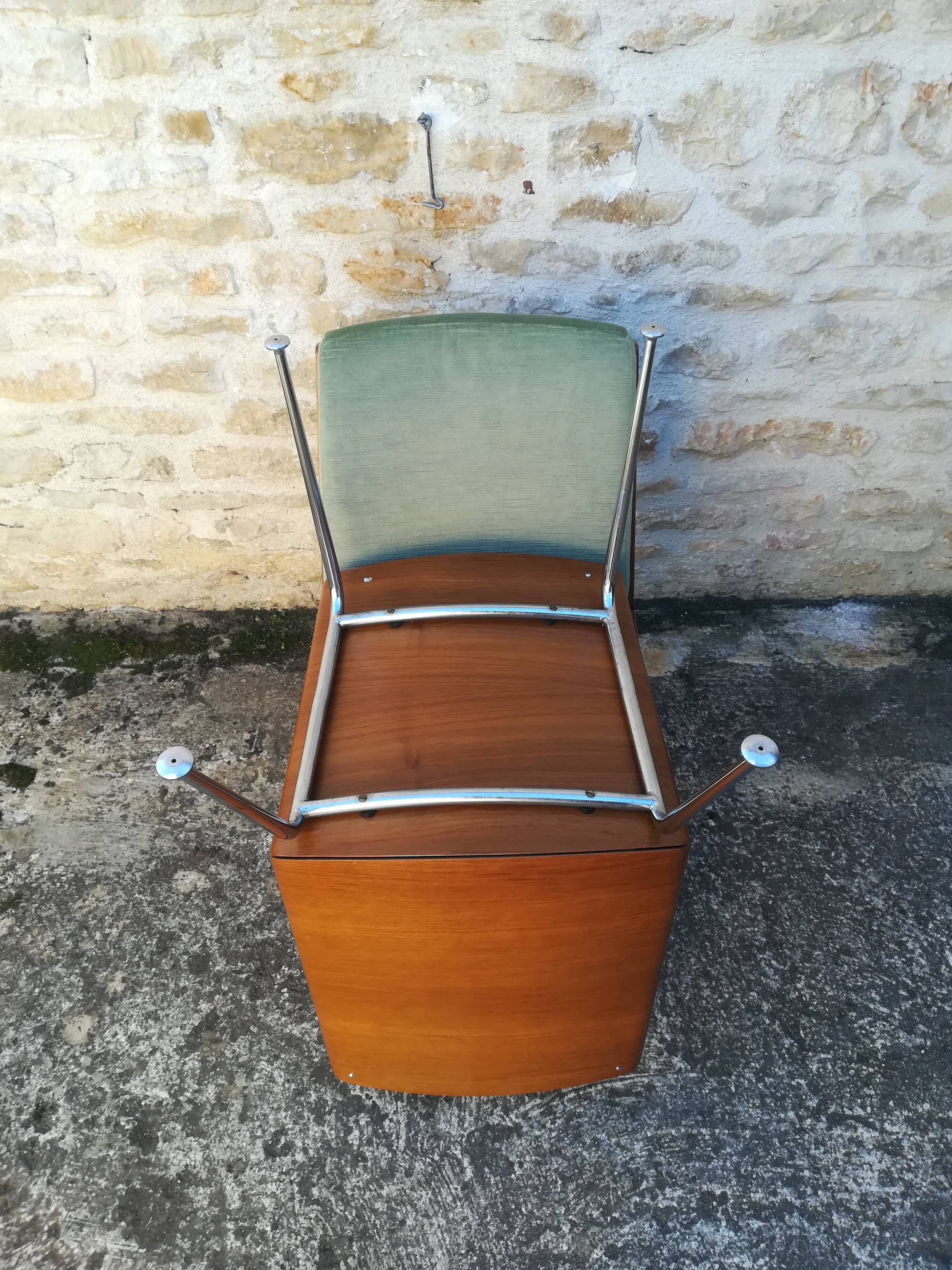 Shell chairs and green fabric
