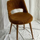 Camel barrel chair with faux fur by Baumann