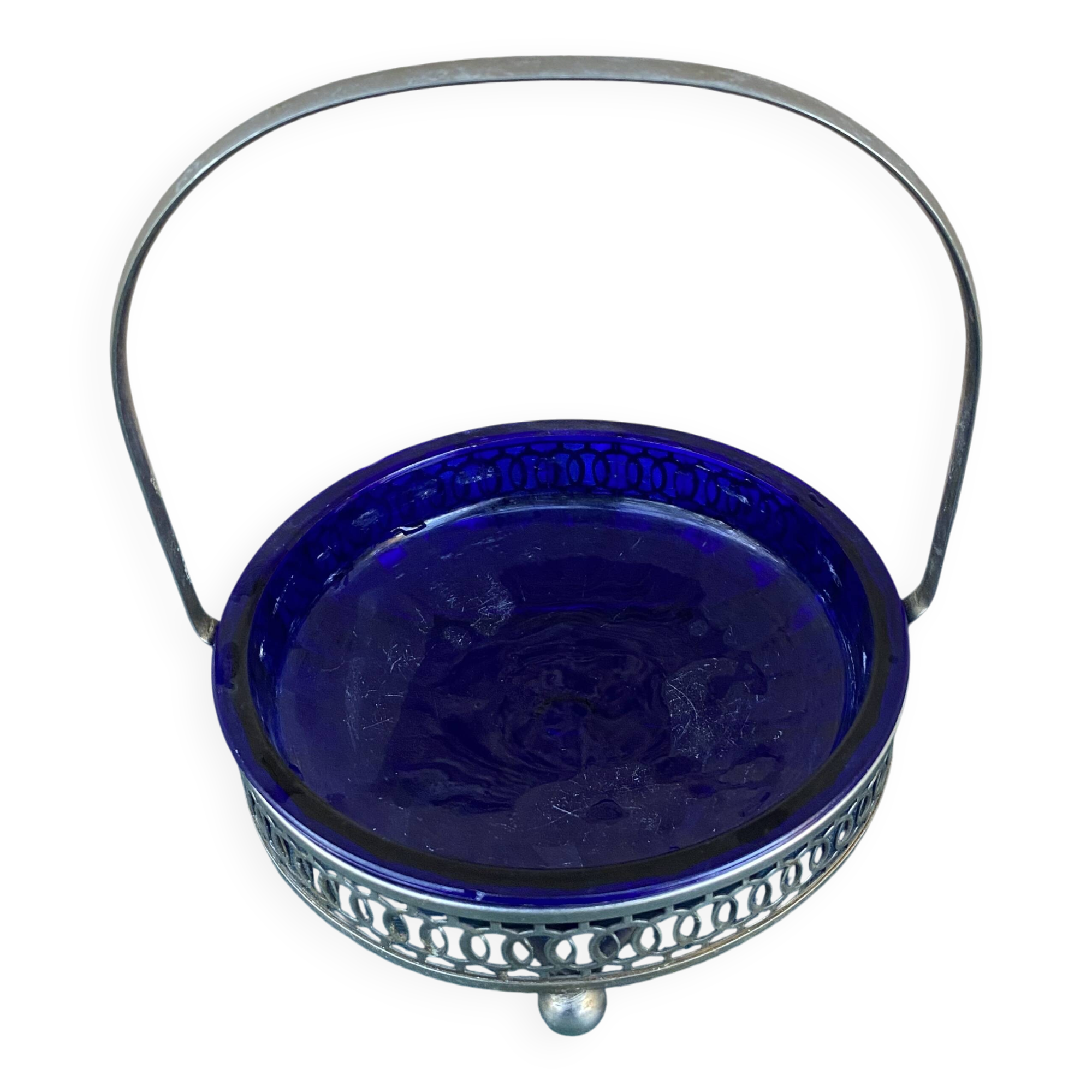 Vintage table basket in cobalt blue glass with a silver metal frame.