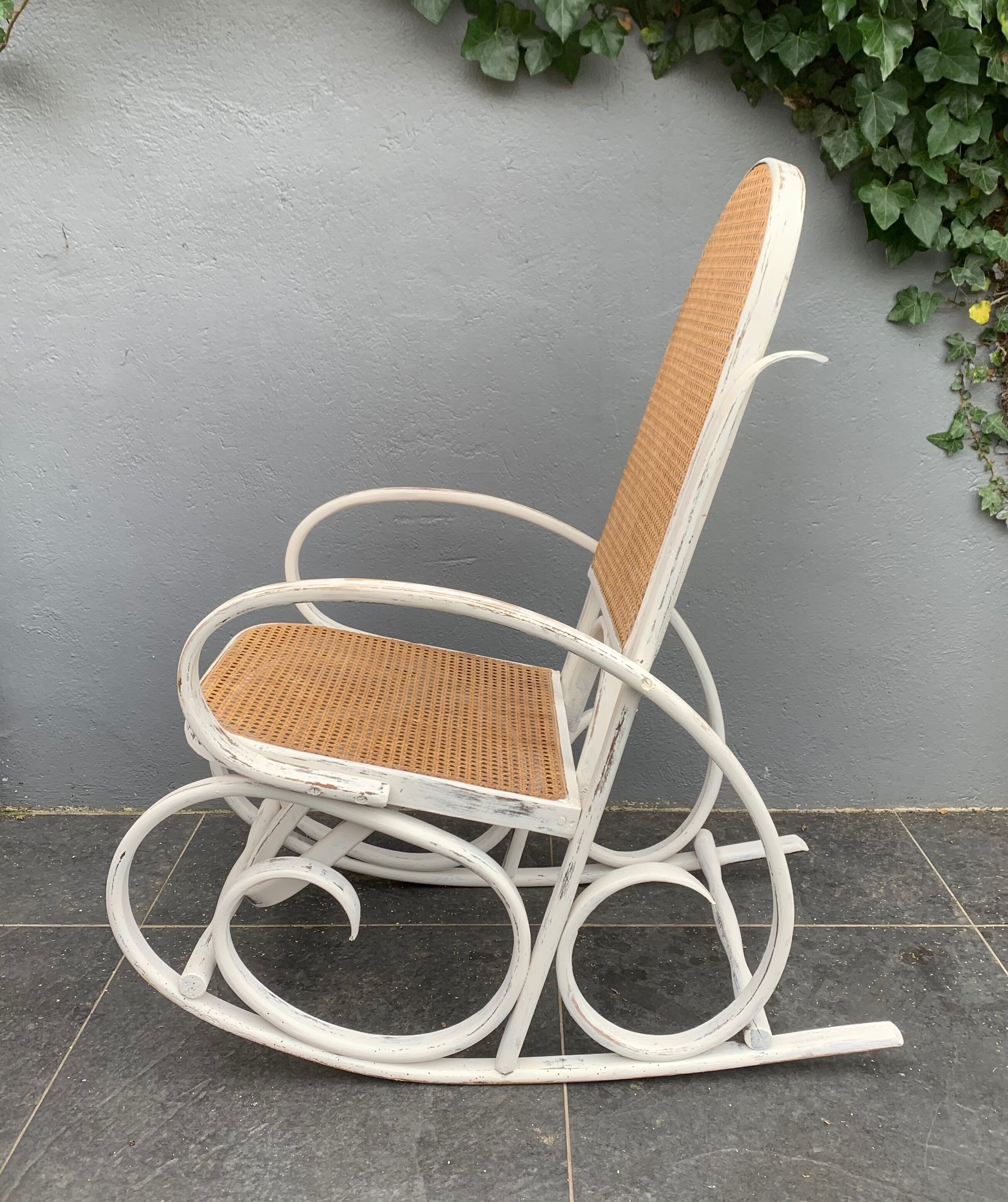 Old rocking chair with white patina