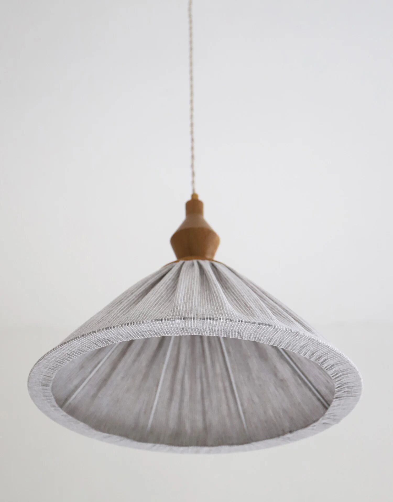 Pleated curtain Olga in linen and cotton with fine classic grey stripes.