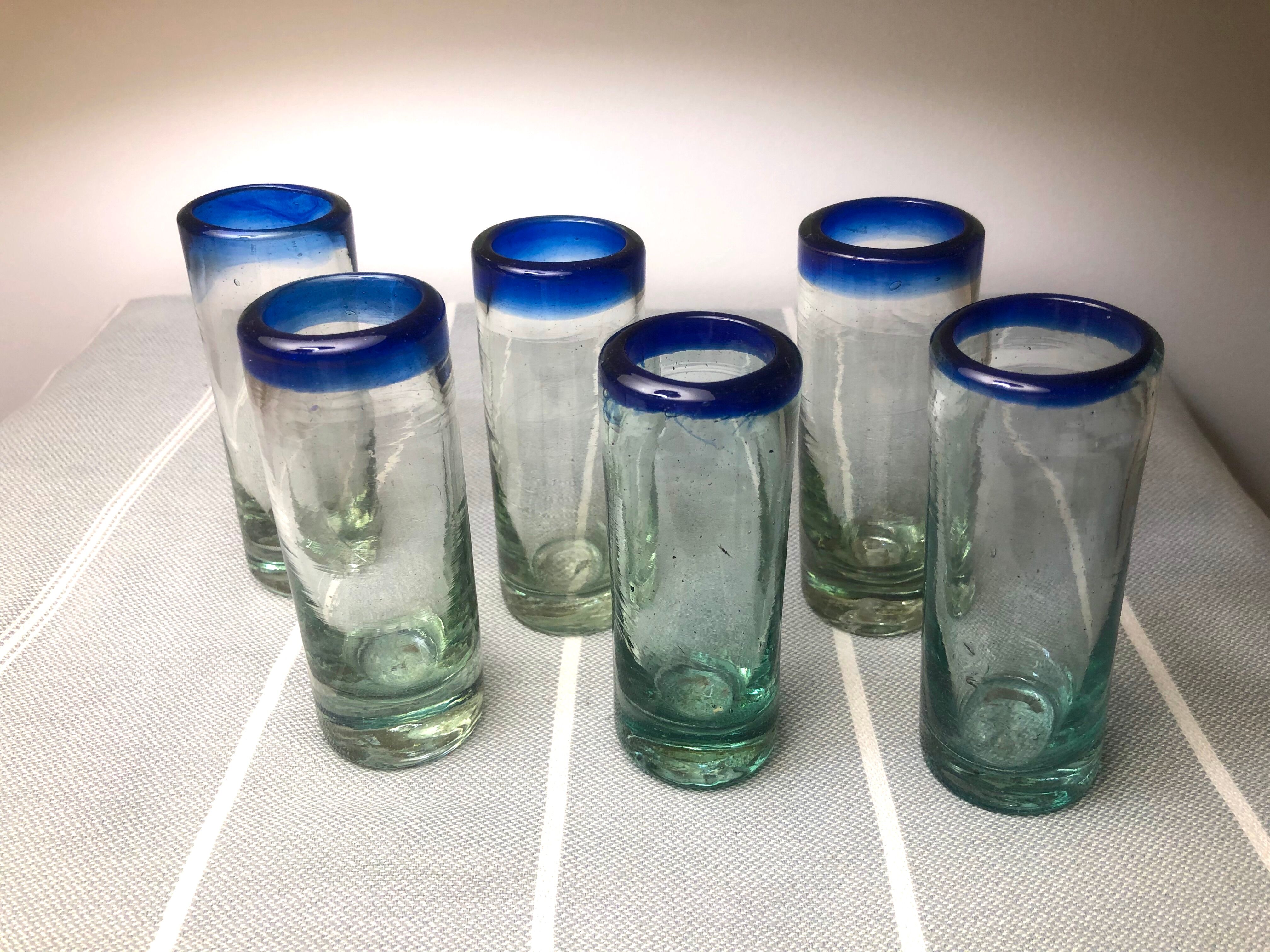 Handmade cobalt blue tequila glasses made of recycled glass