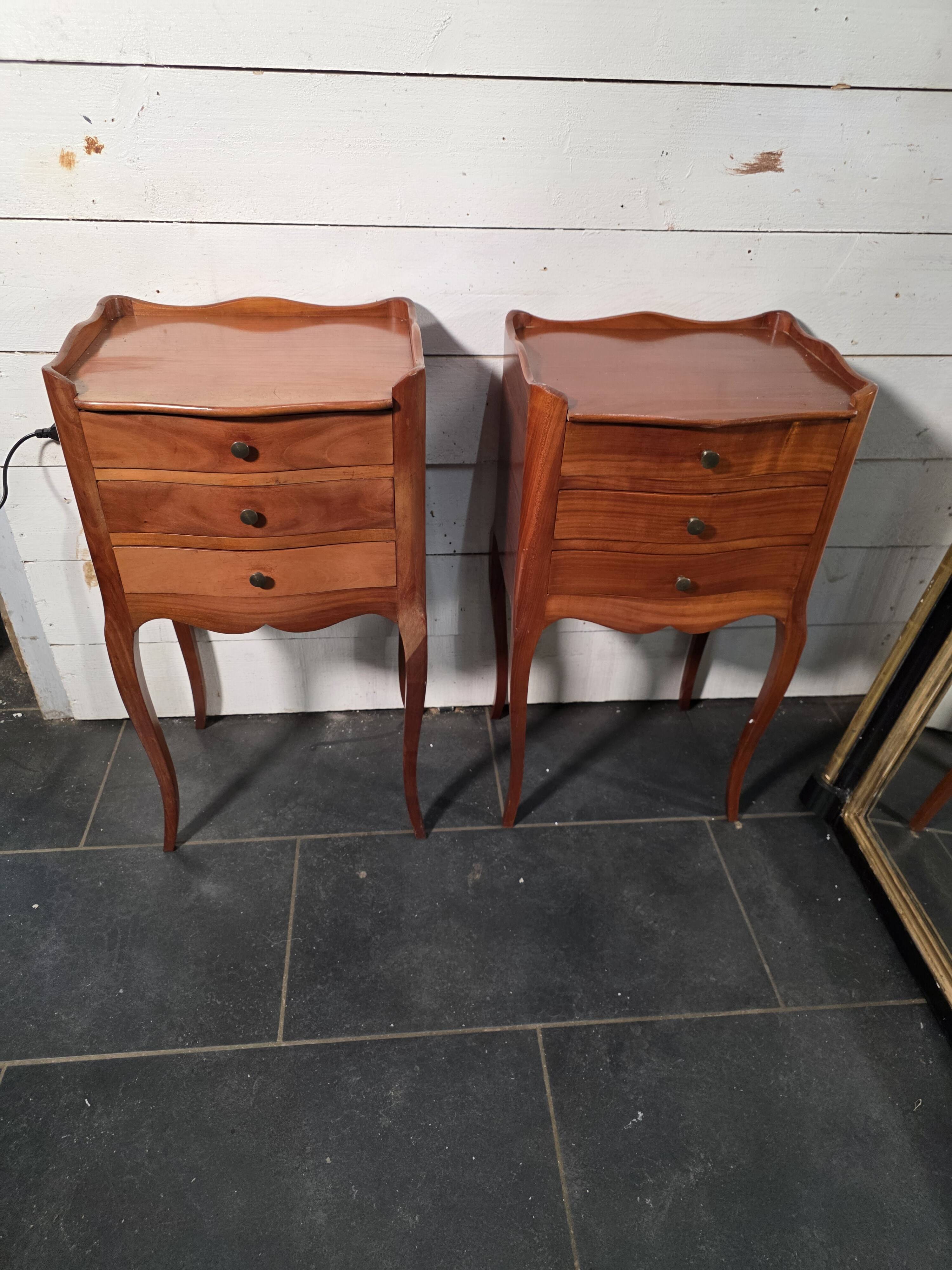Pair of Louis XV style bedside tables in cherry wood.