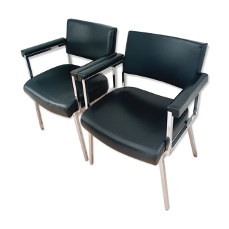 Pair of black skaï and chrome armchairs
