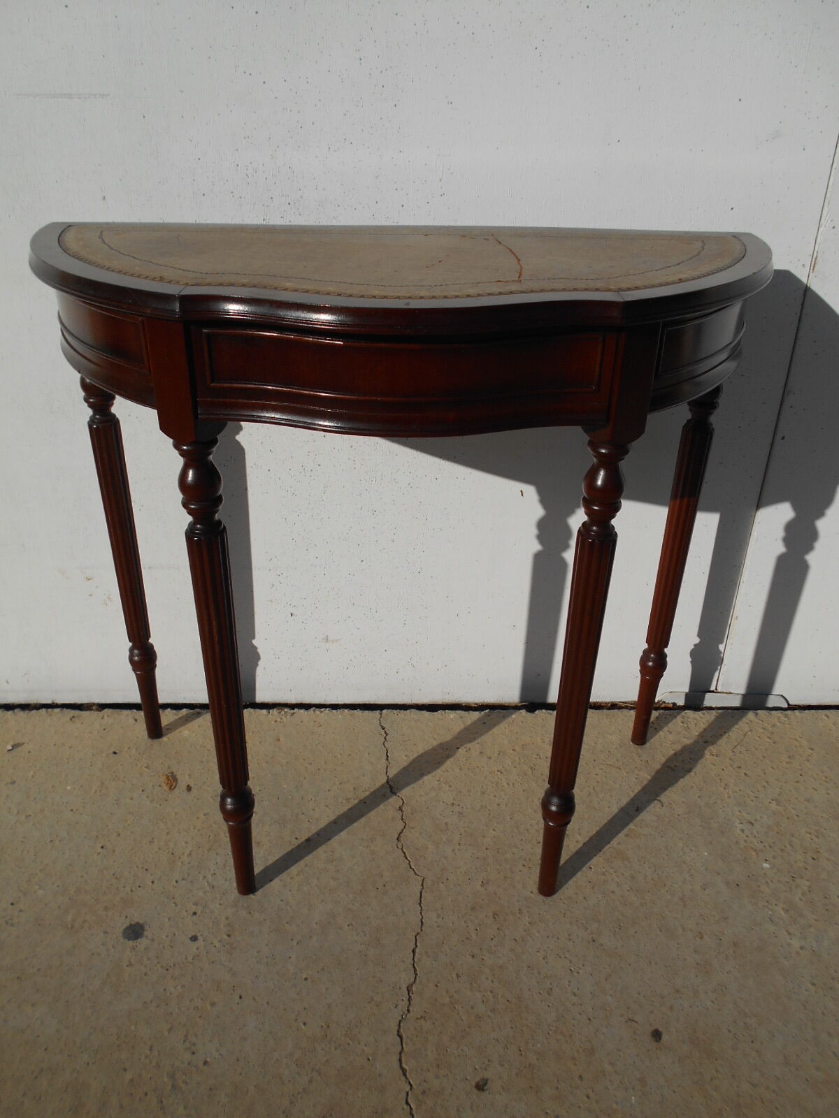 English-style half-moon console, mahogany and leather