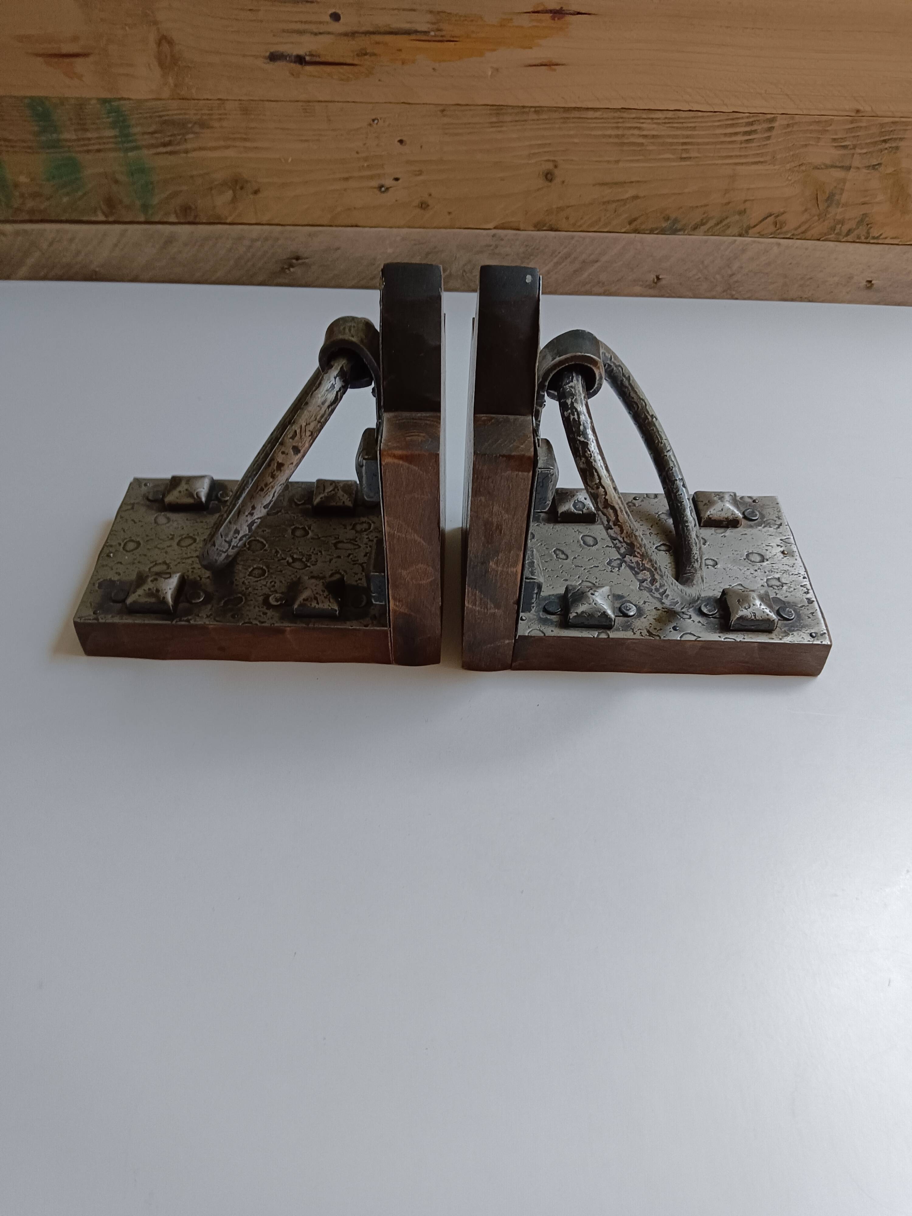 Medieval-style bookends, antique door handle.