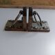 Medieval-style bookends, antique door handle.