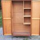 Vintage oak wardrobe with metal legs from the 1950s.