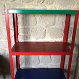 Shelf on multi-colored metal feet
