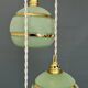 Suspension triple vintage glass globes in frosted green and gold.