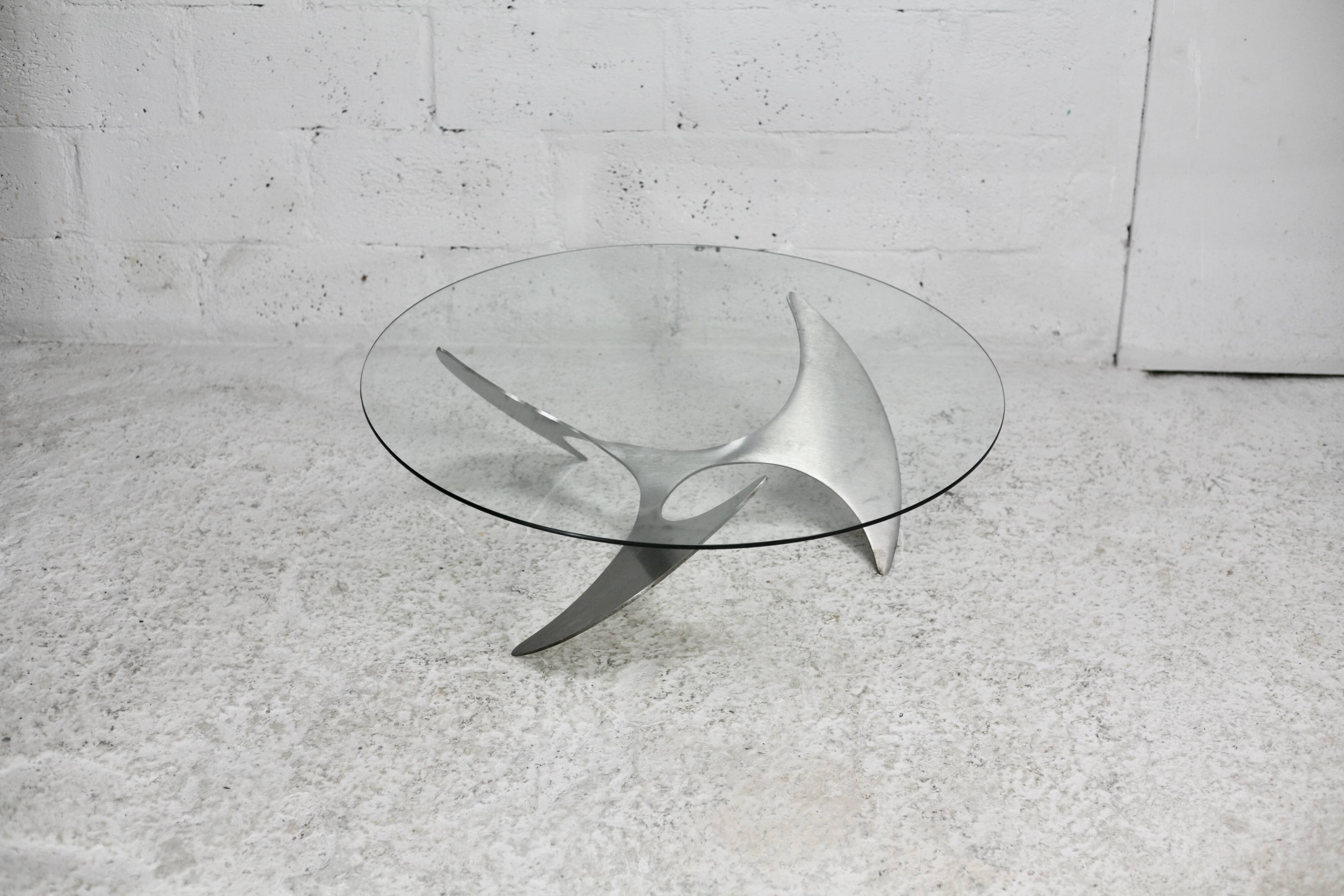 "space age" coffee table. Steel legs, glass slab. Circa 1970