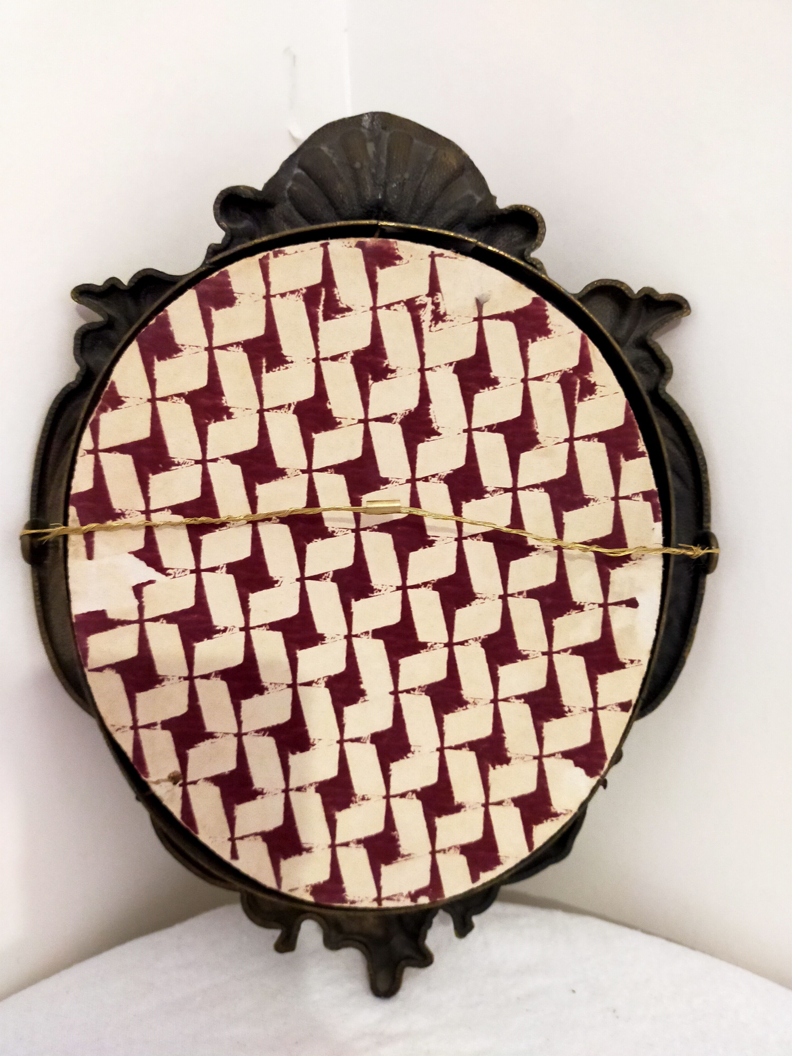 Gilded bronze mirror with angels and scrolls