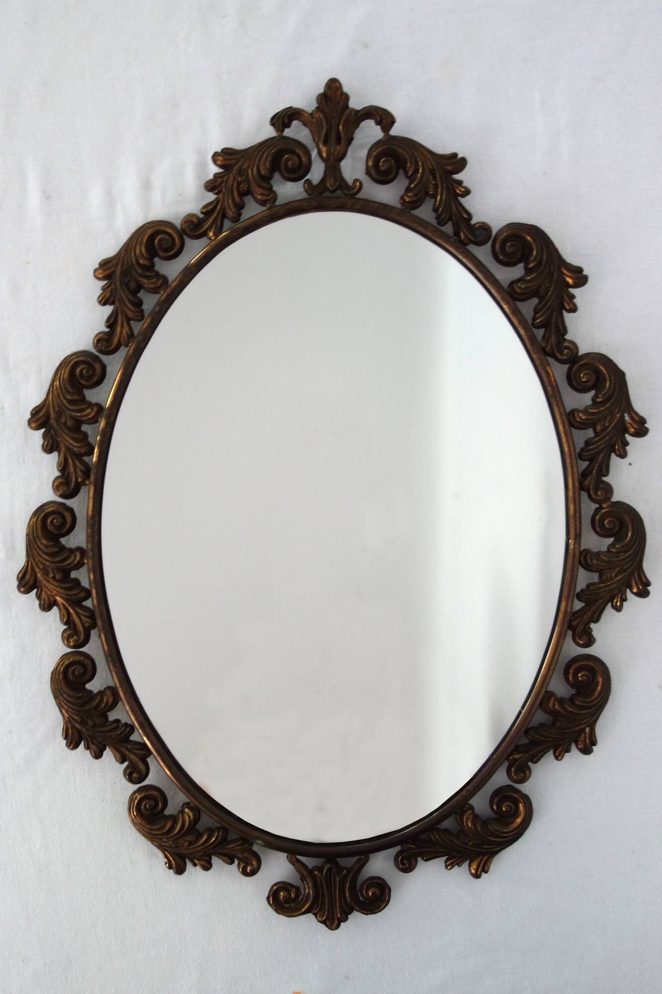 Antique oval art deco brass mirror