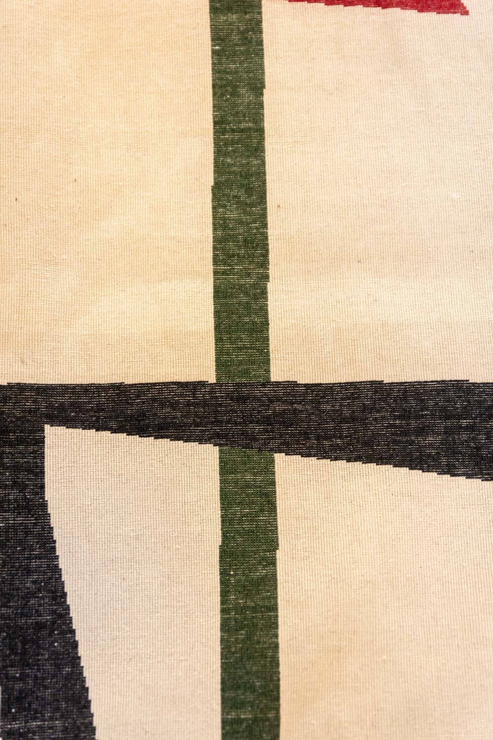 Handwoven wool tapestry with colourful geometric design. 2026.