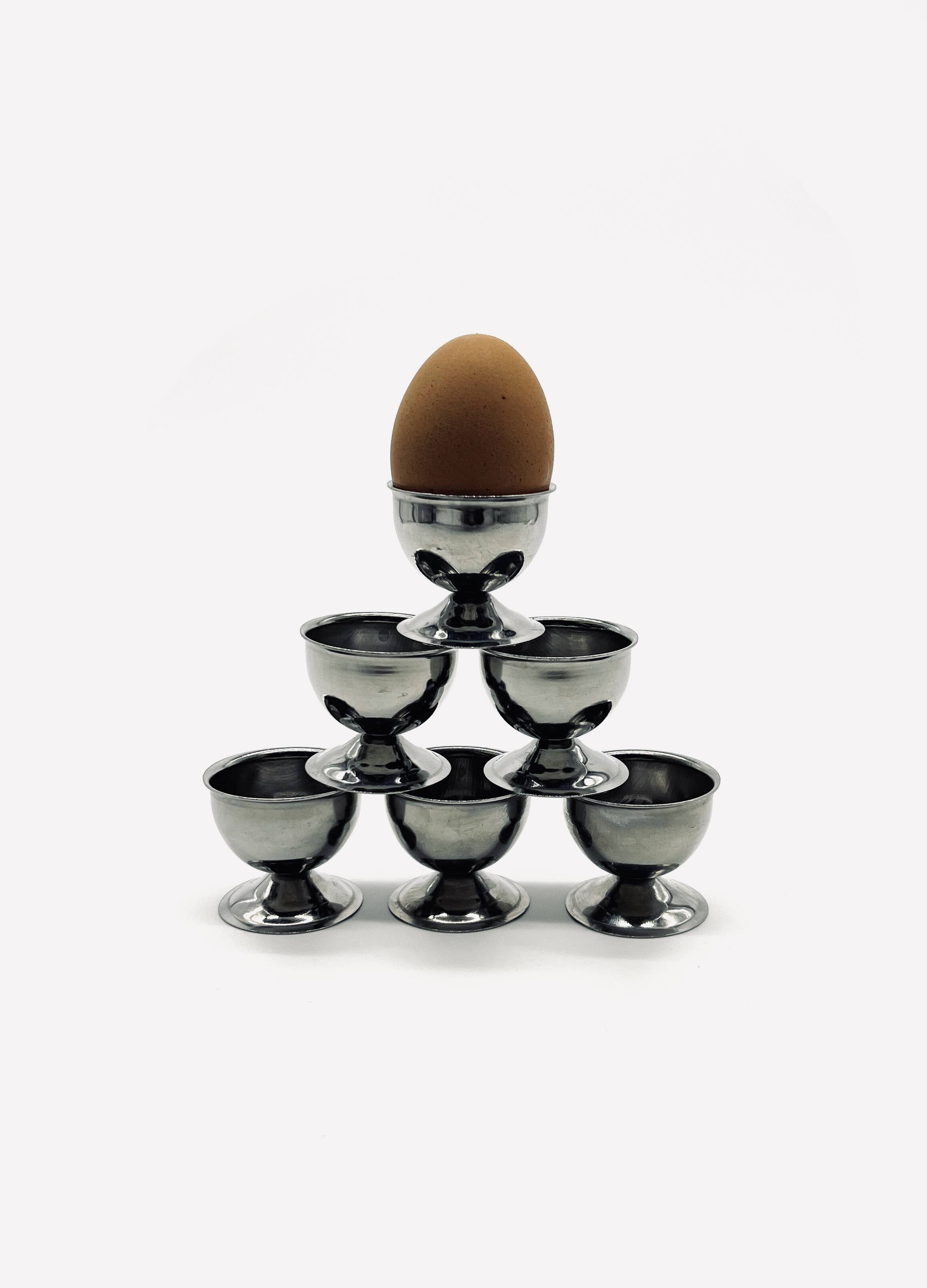 Six stainless steel egg cups