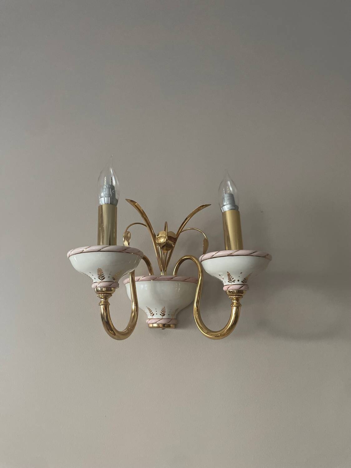 Two chandeliers and two porcelain wall lights, Italy