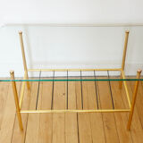 Glass coffee table with magazines holder