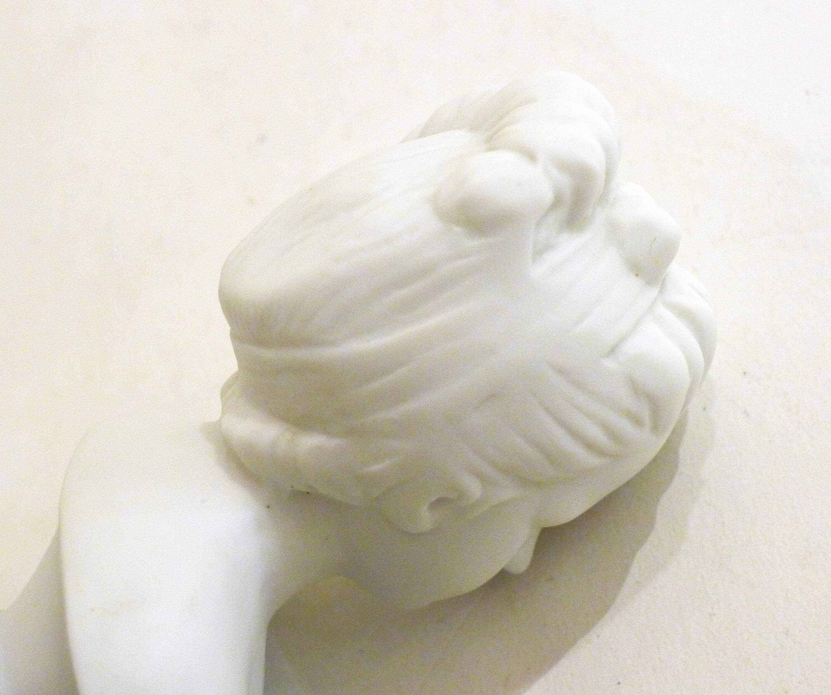 Pair of busts in biscuits
