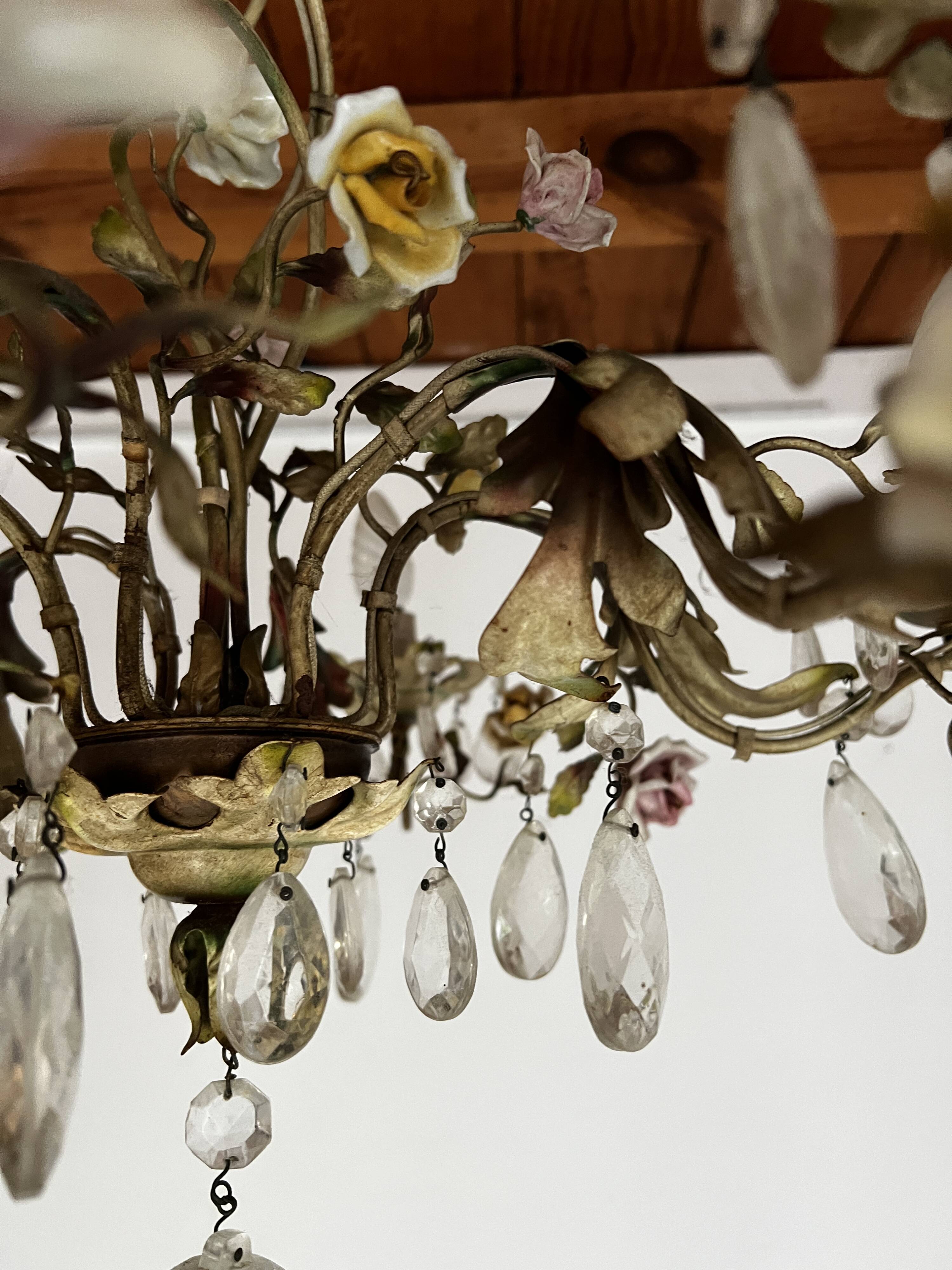Chandelier with a floral porcelain decoration and pendants