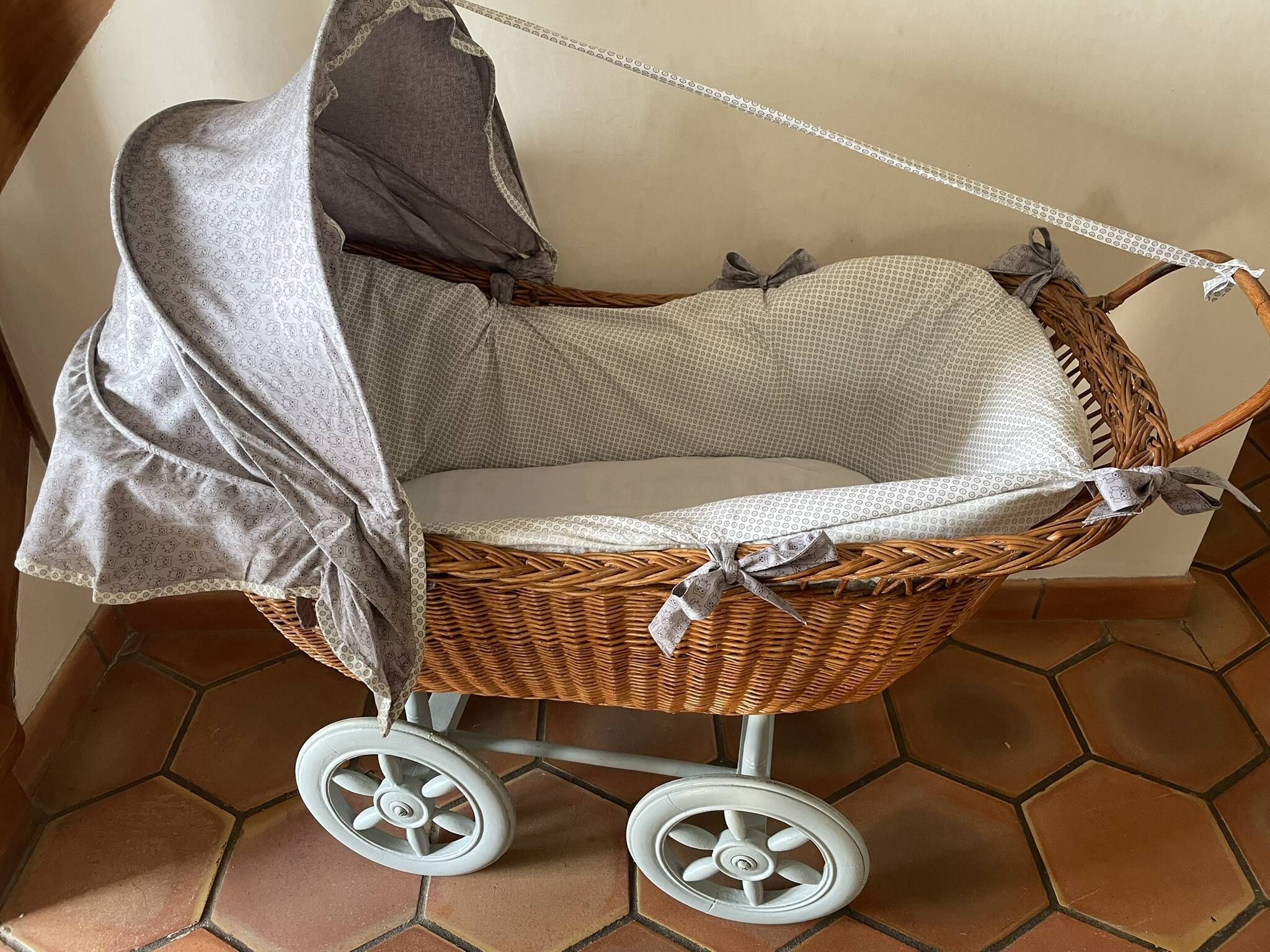 Antique rattan cradle in very good condition. Sold with or without upholstery.