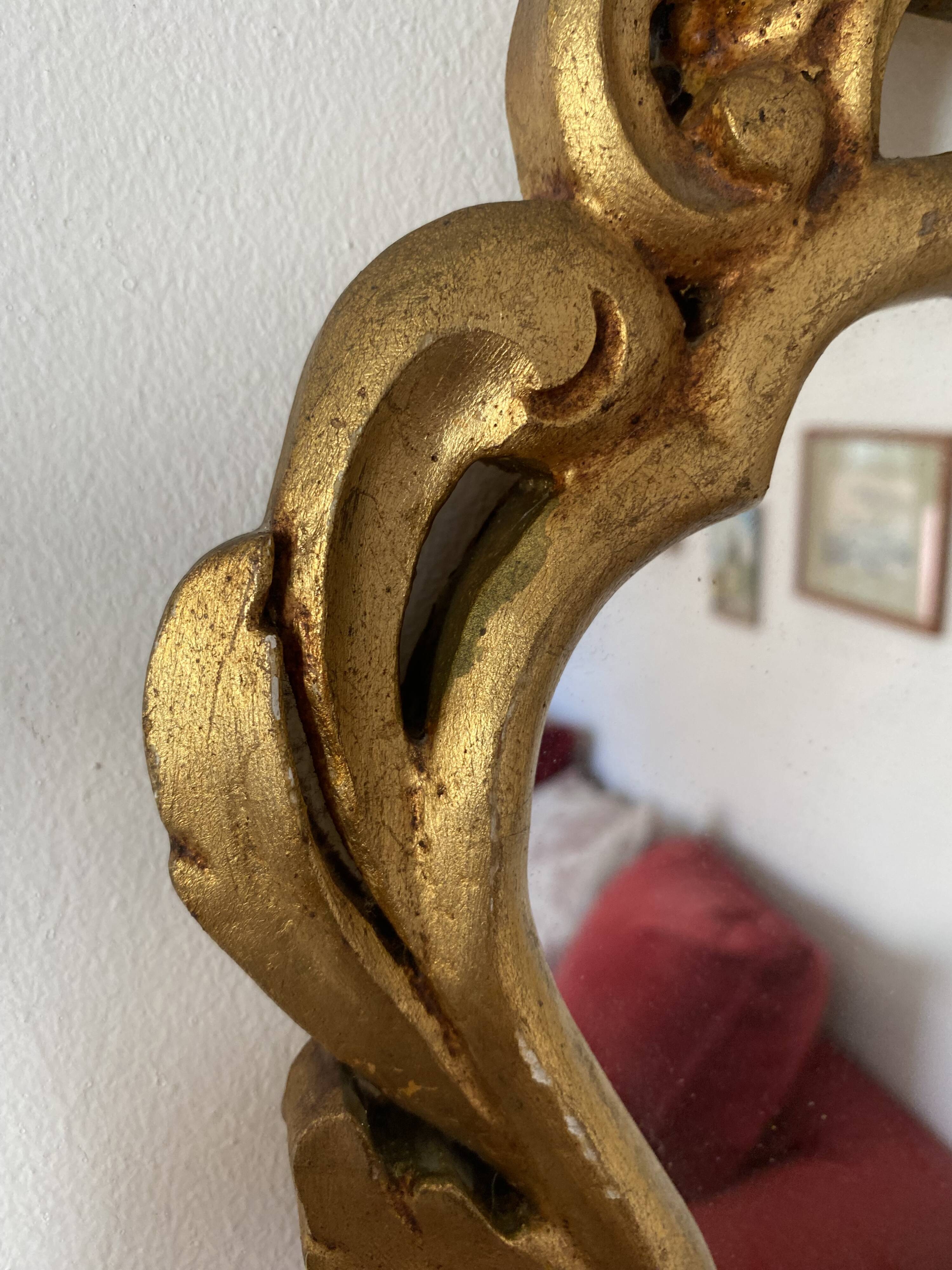 Golden mirror in baroque style.