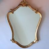 1950s rococo mirror in gilded stucco.