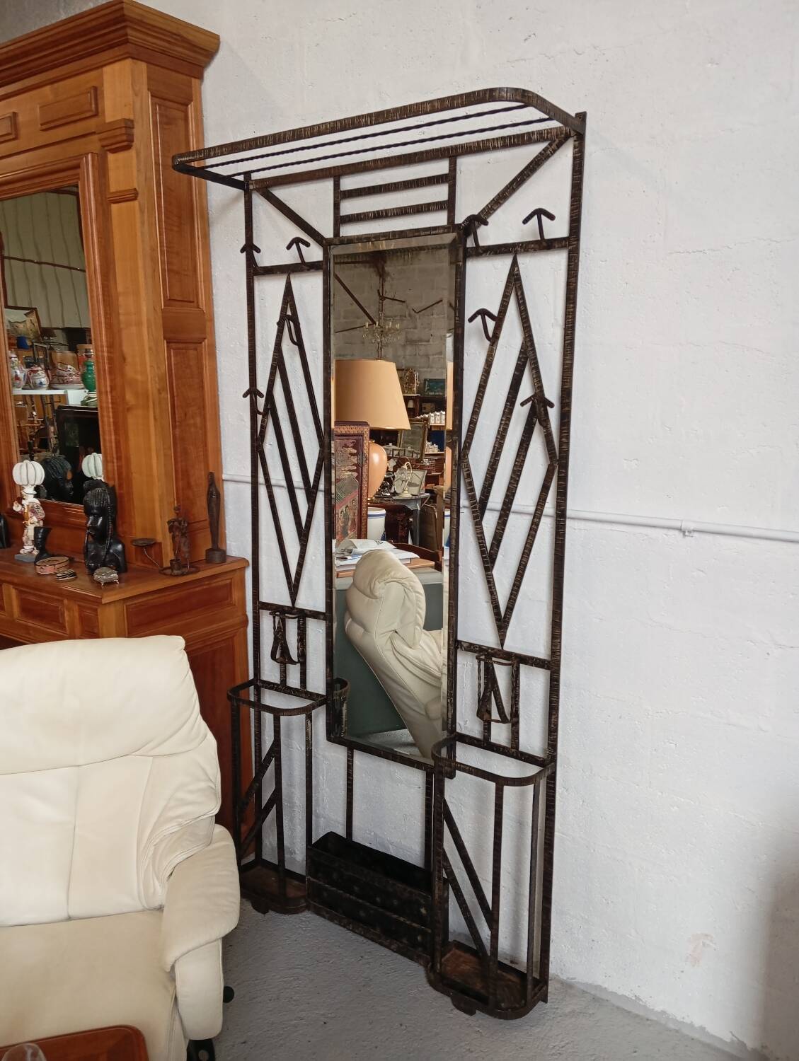 Exceptional and imposing hall wardrobe in hammered wrought iron.