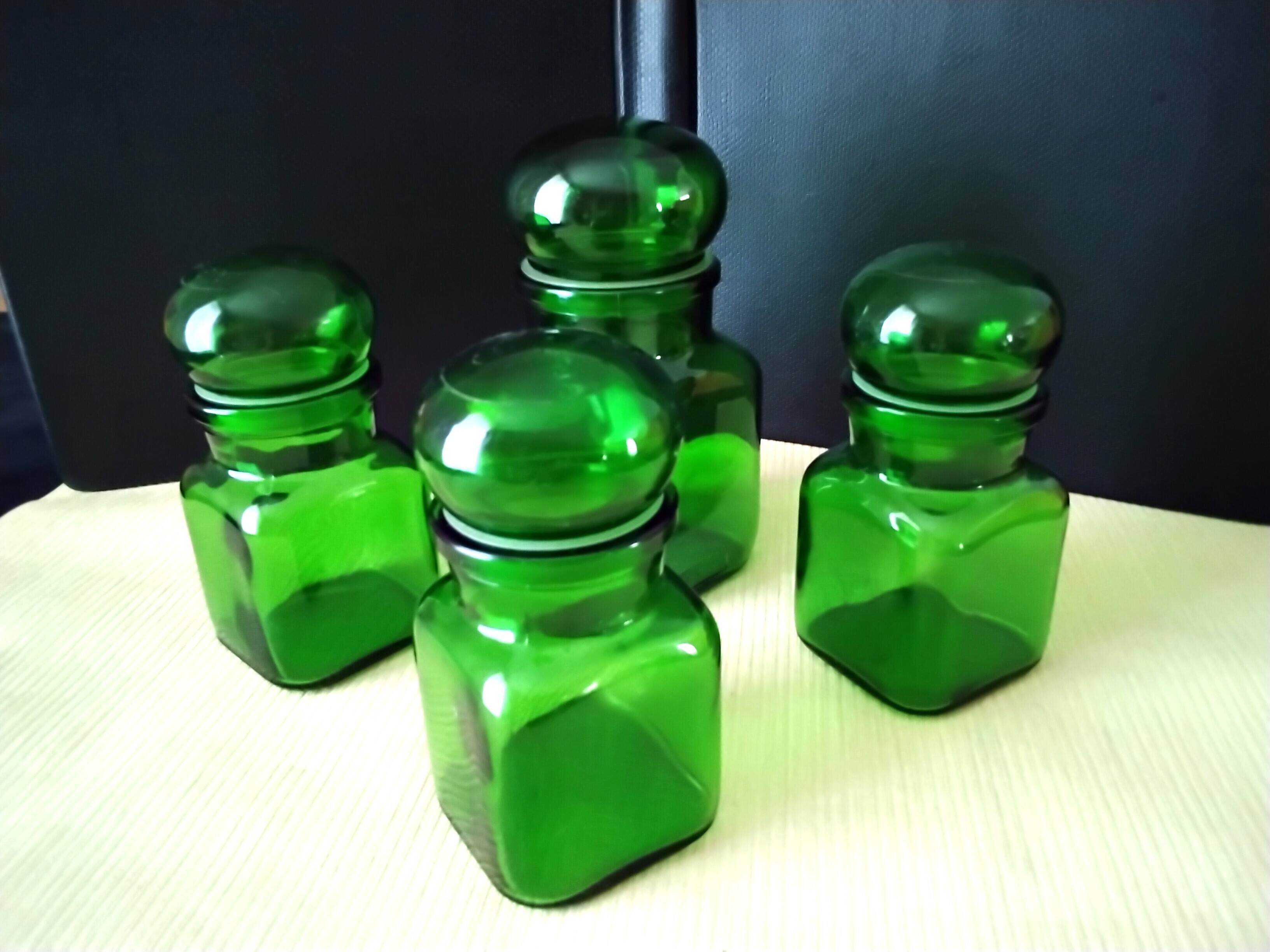 Set of 4 green glass jars, bottles from the 1970s.
