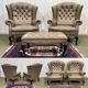 Pair of high-backed Chesterfield armchairs with 1 leather footrest