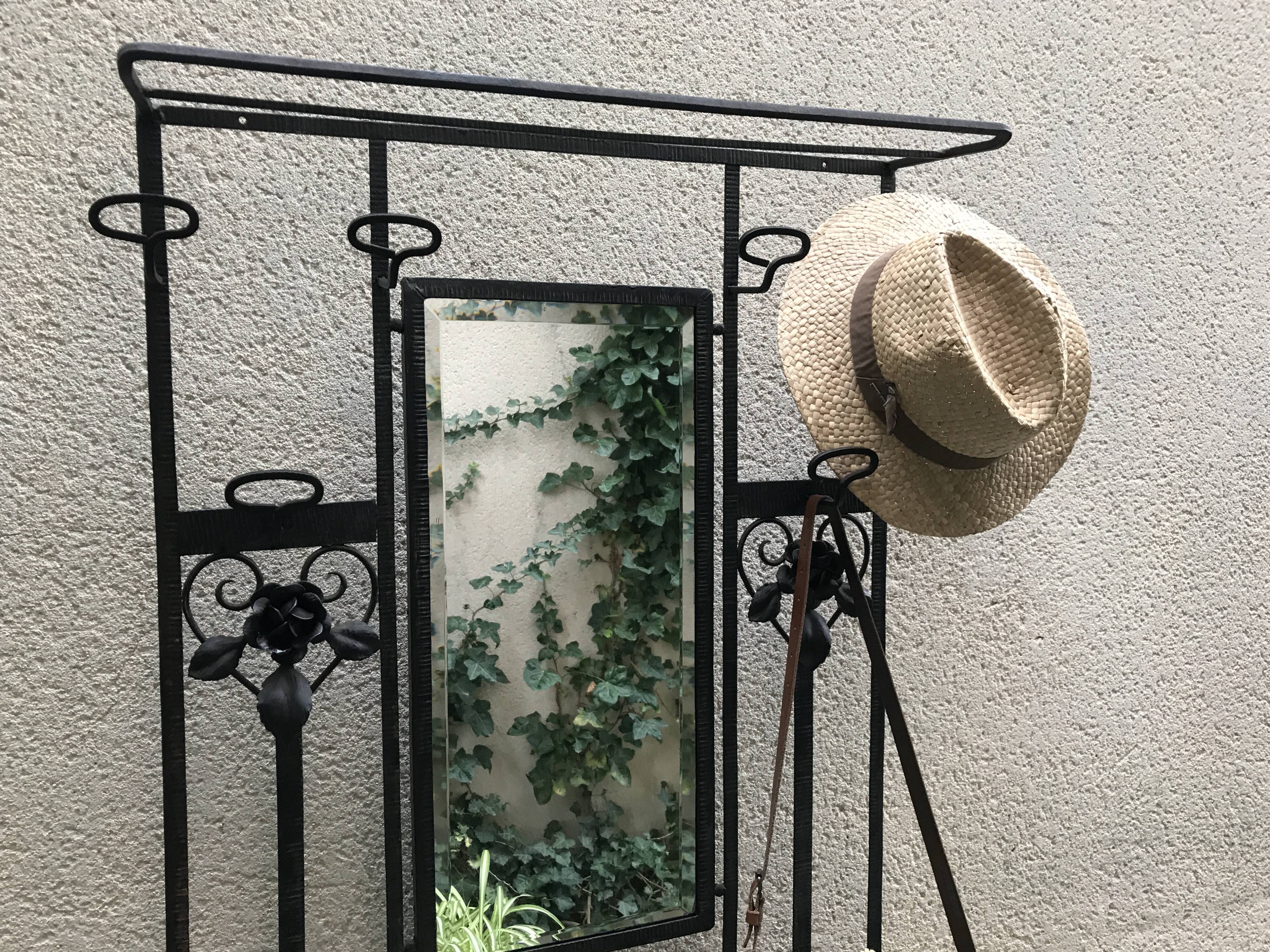 Wrought iron coat holder with 1930