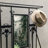 Wrought iron coat holder with 1930