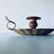 Old candle holder in brown enameled metal