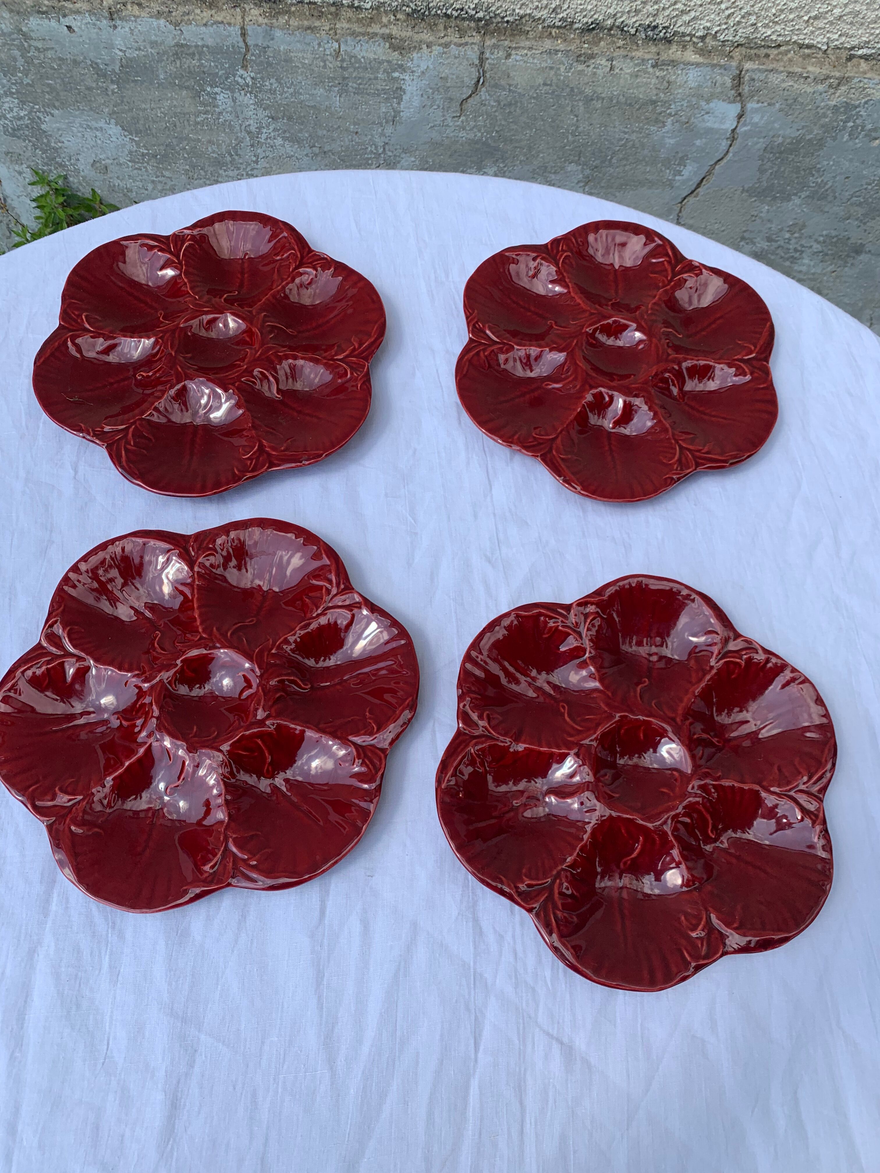 4 oyster plates in vintage red glazed ceramic slip and collector