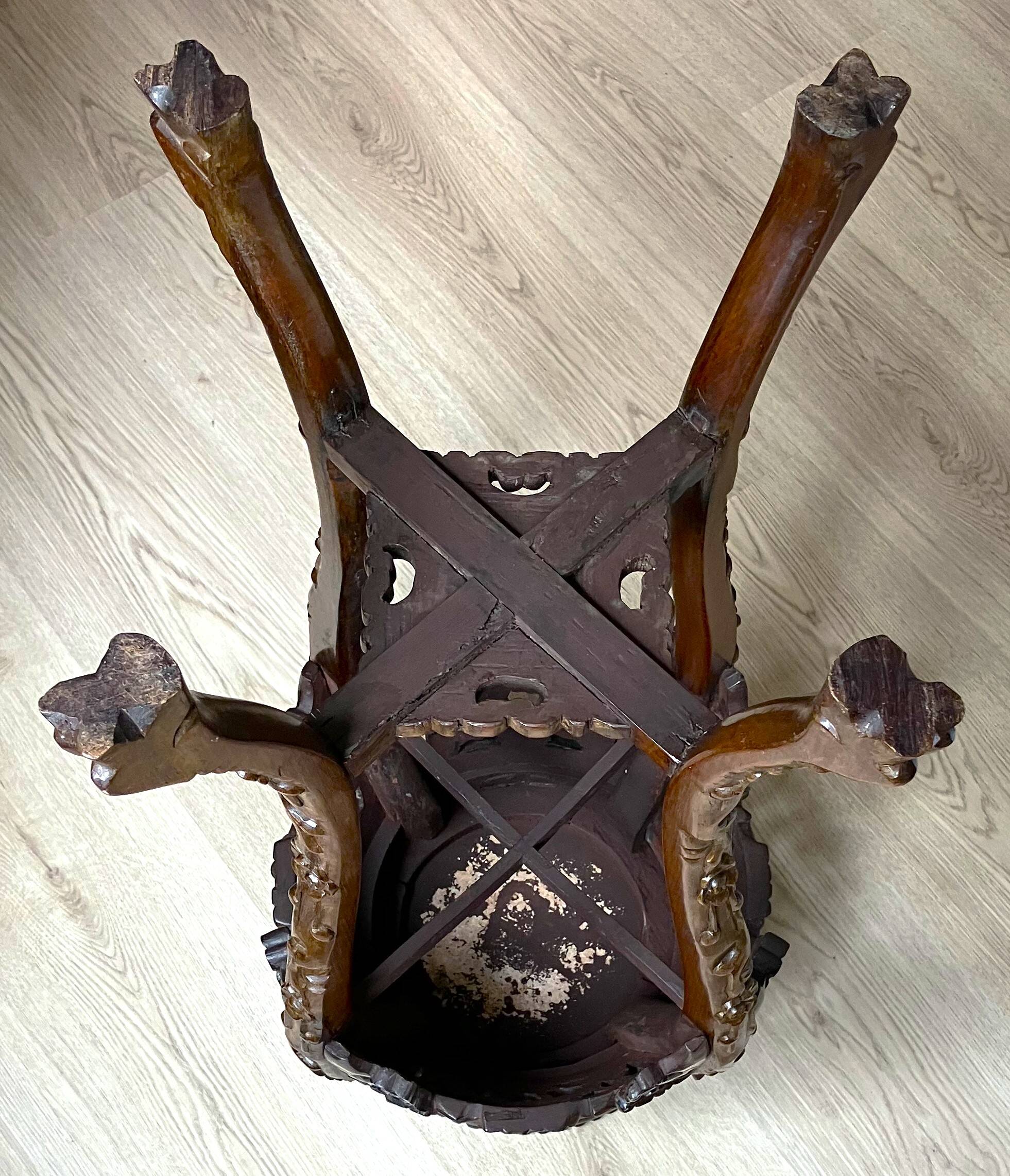 Chinese stool from the 19th century, made of wood and marble. In very good condition.