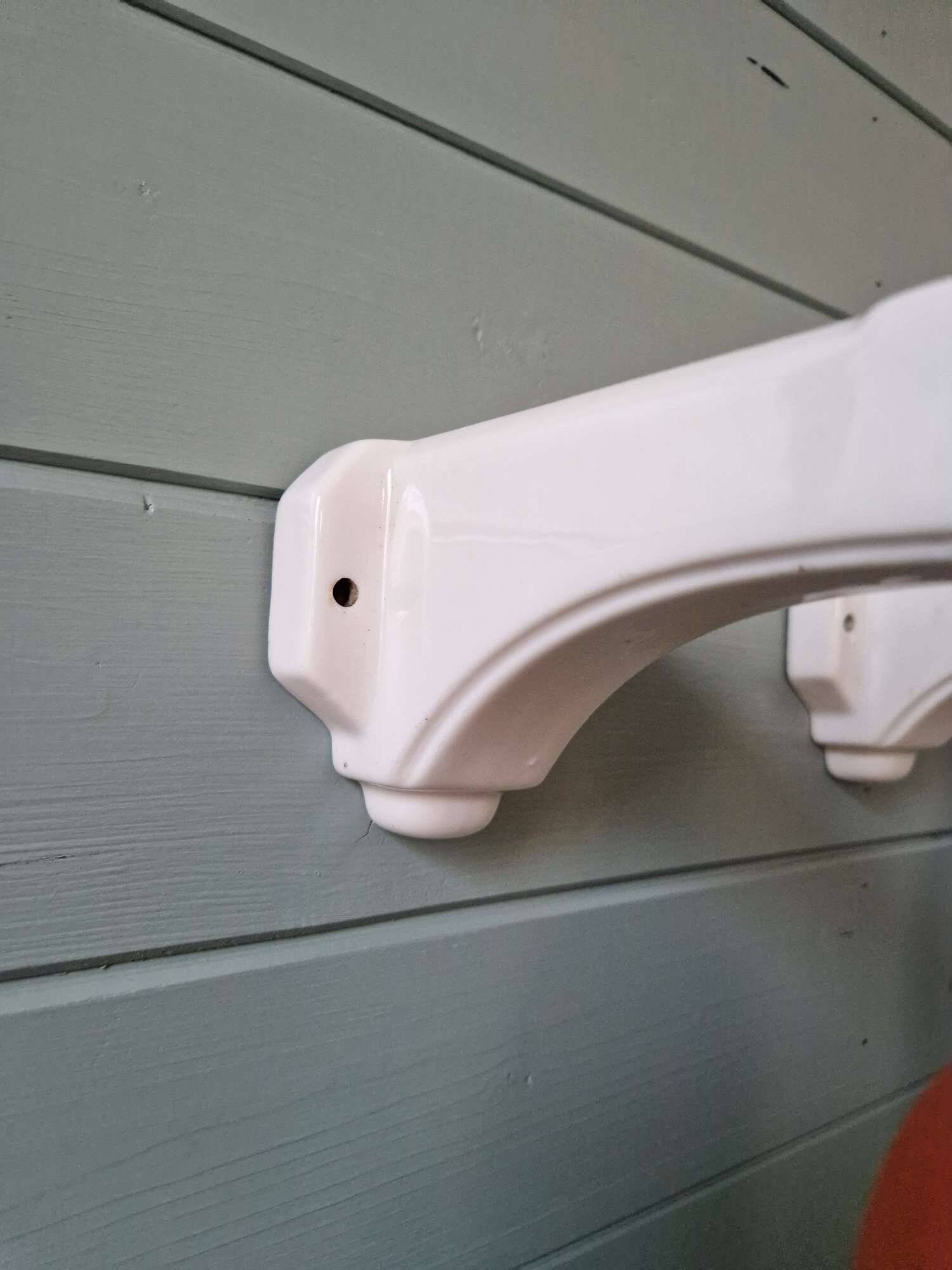 Pair of Art Deco wall sconces in multicoloured porcelain and frosted glass.