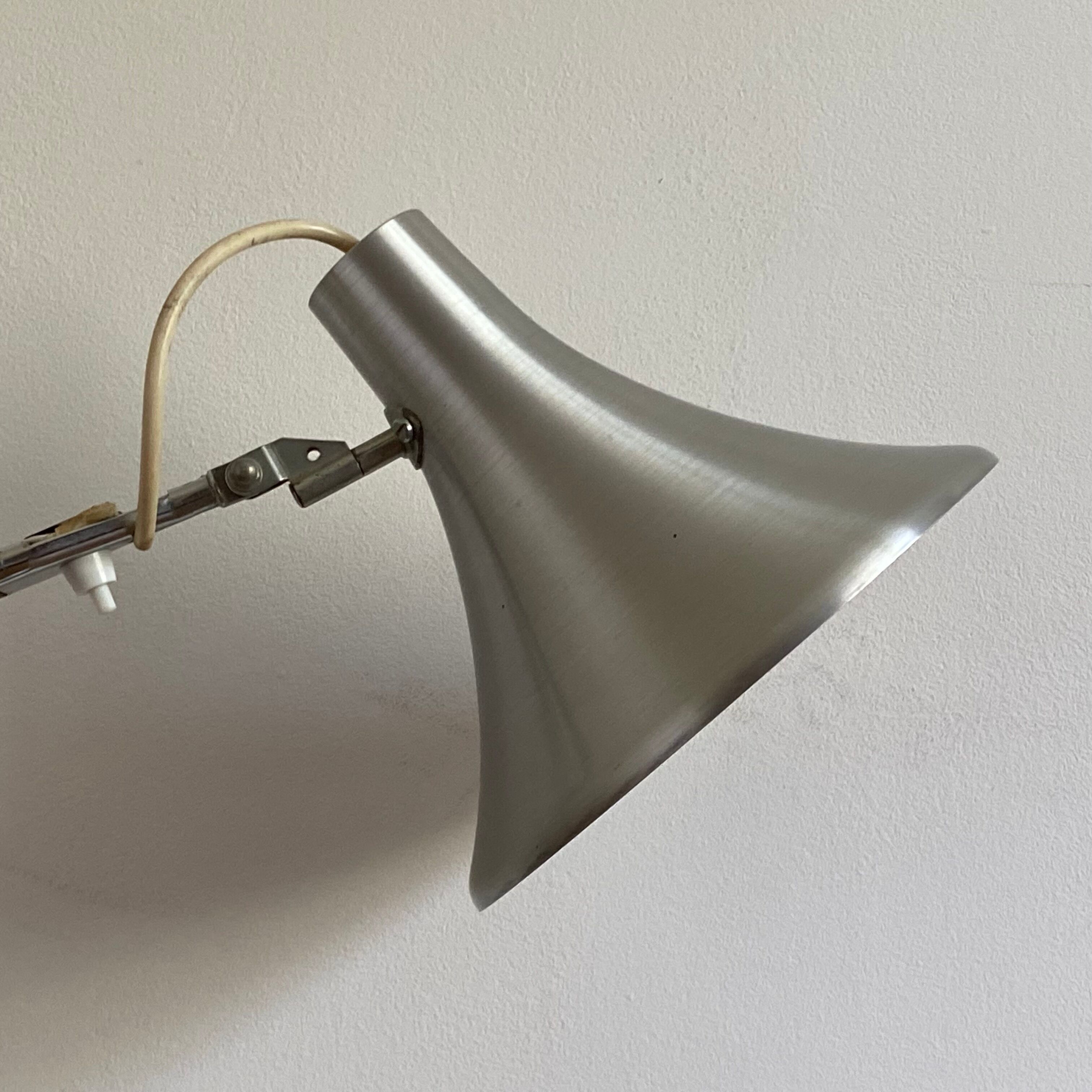 Vintage articulated lamp. Stainless steel and chromium. 1960 70.