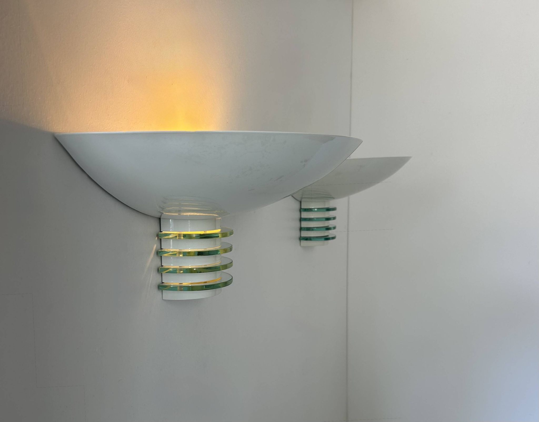 Pair of post-modernist wall lights, white metal and glass, France 1980