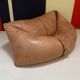 Two-seater leather pouf sofa by Raphaël Raffel for Honoré Paris