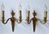 Pair of classic electrified brass wall lights.