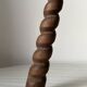 Wooden stool with three twisted legs
