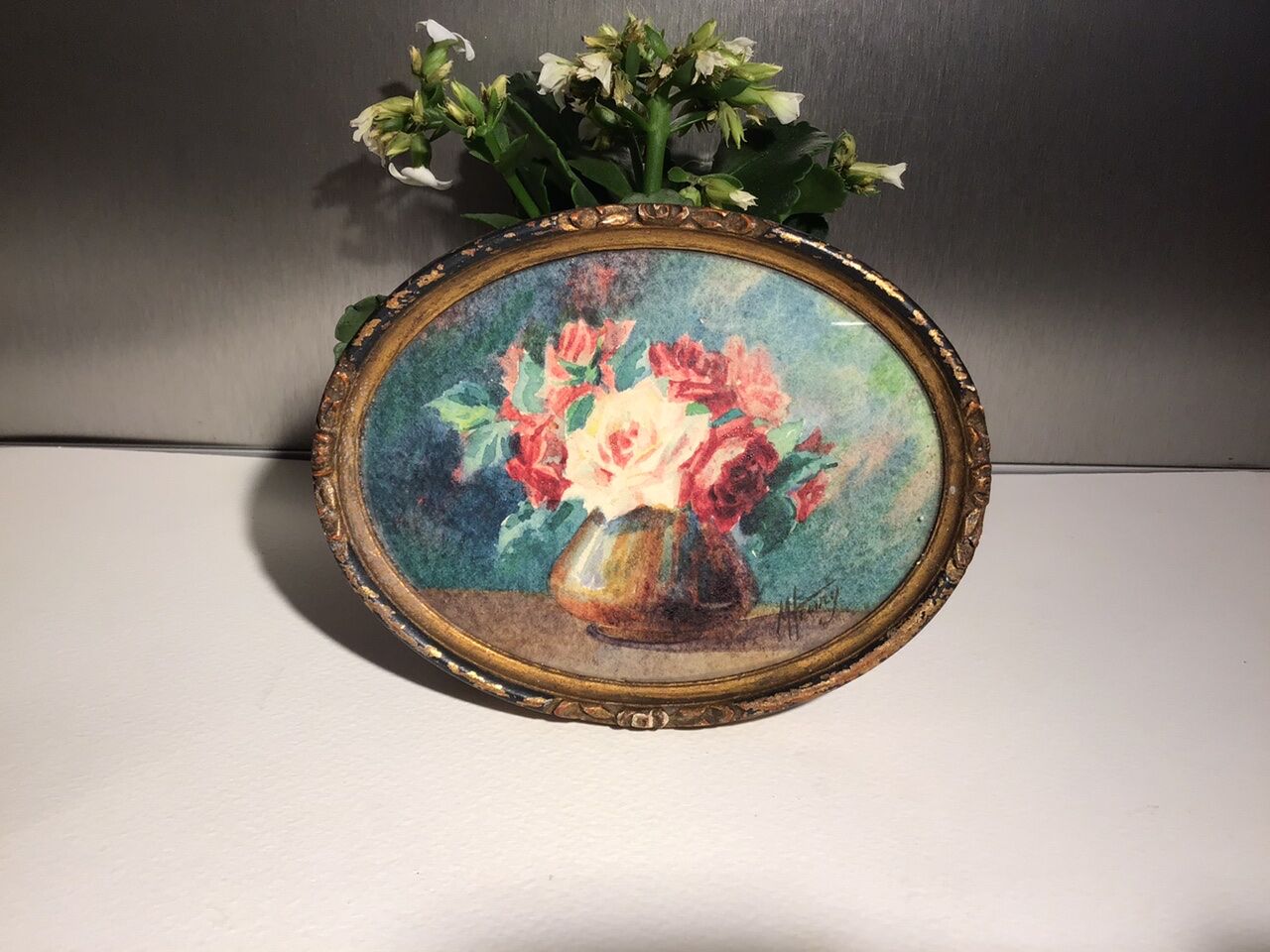 Three old paintings, still lifes with bouquets of roses, signed M Henry