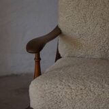Modern Danish design, a pair of high-backed armchairs in oak and lambswool, 1950s.