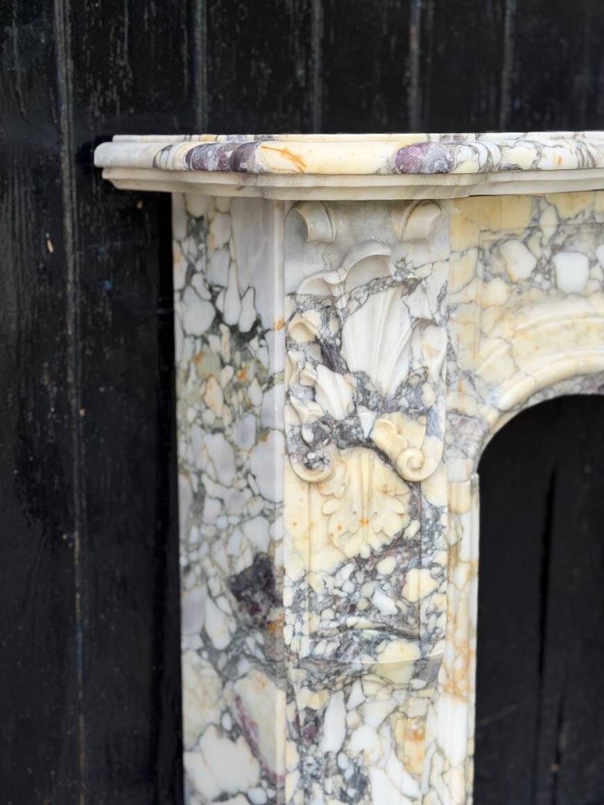 Louis XV style fireplace in purple breccia marble, circa 1880.