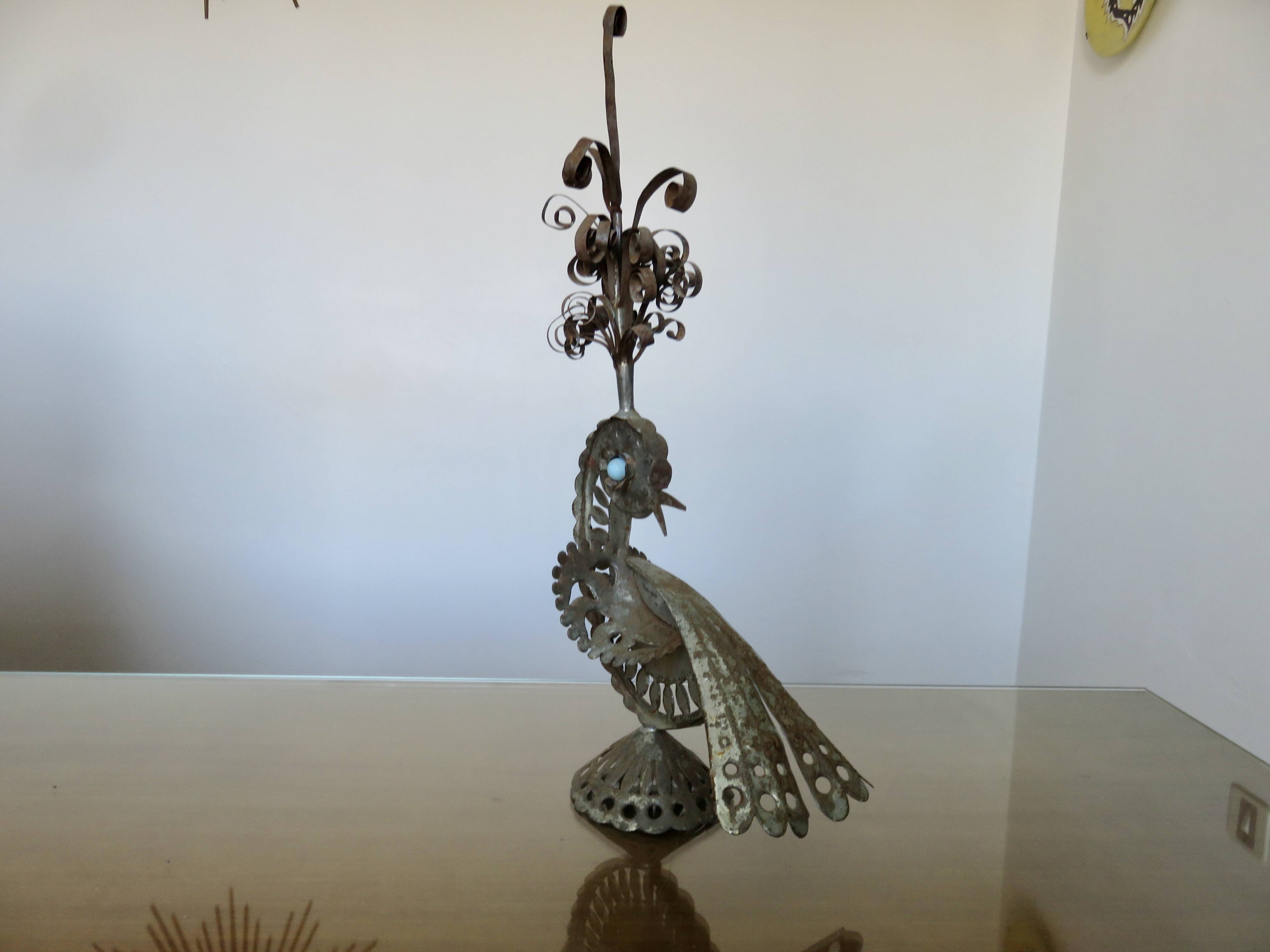 metal sculpture in sheet metal representing a peacock, work from the 1960s
