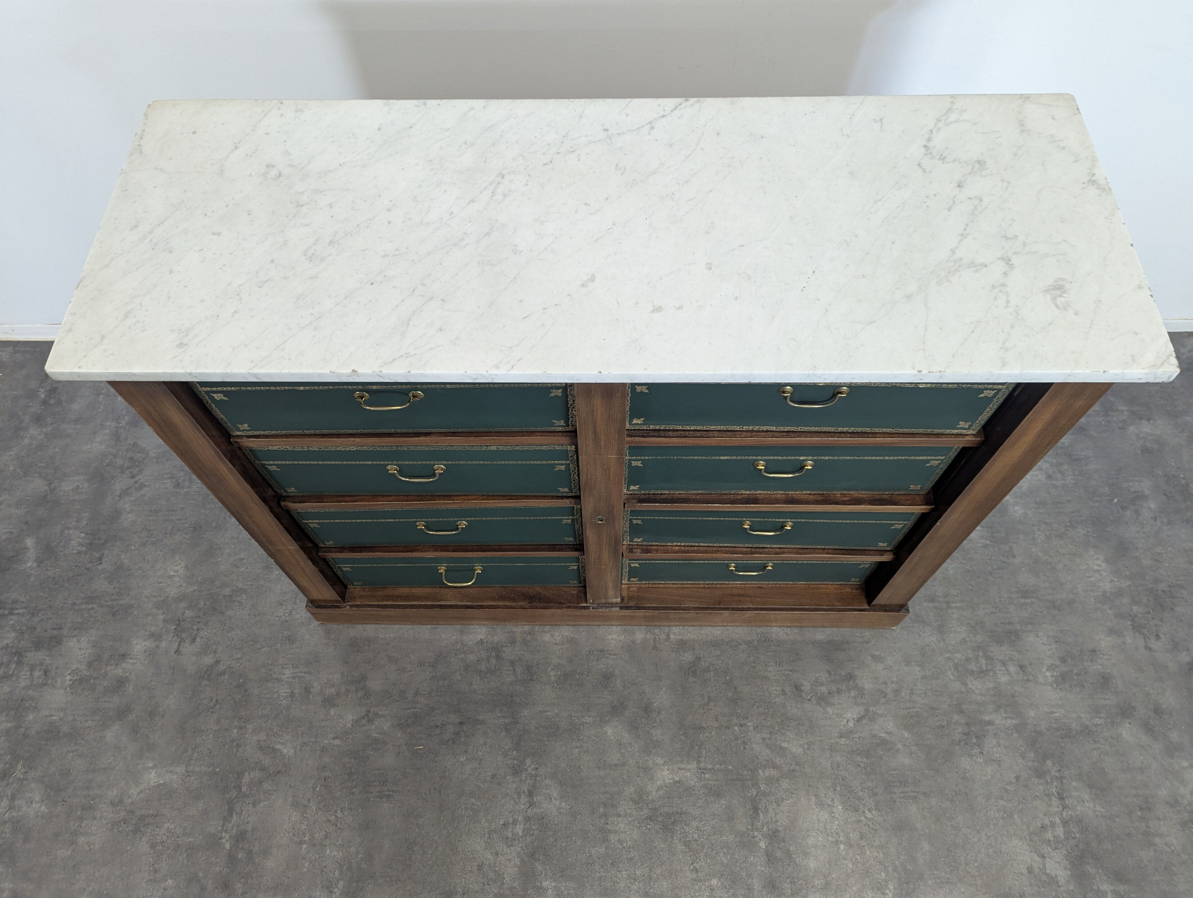 Notary cabinet topped with a Carrara marble.
