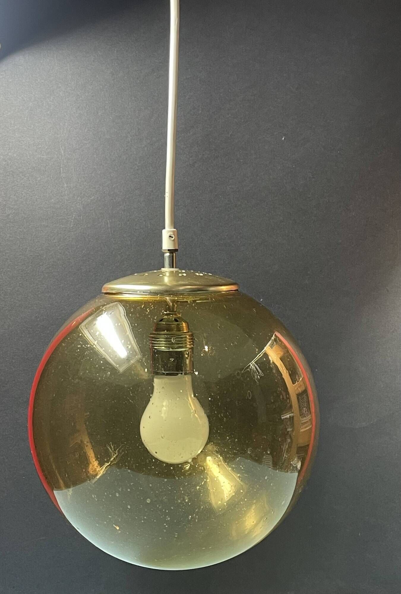 Pair of vintage smoked glass ball pendant lights from Biot glassworks
