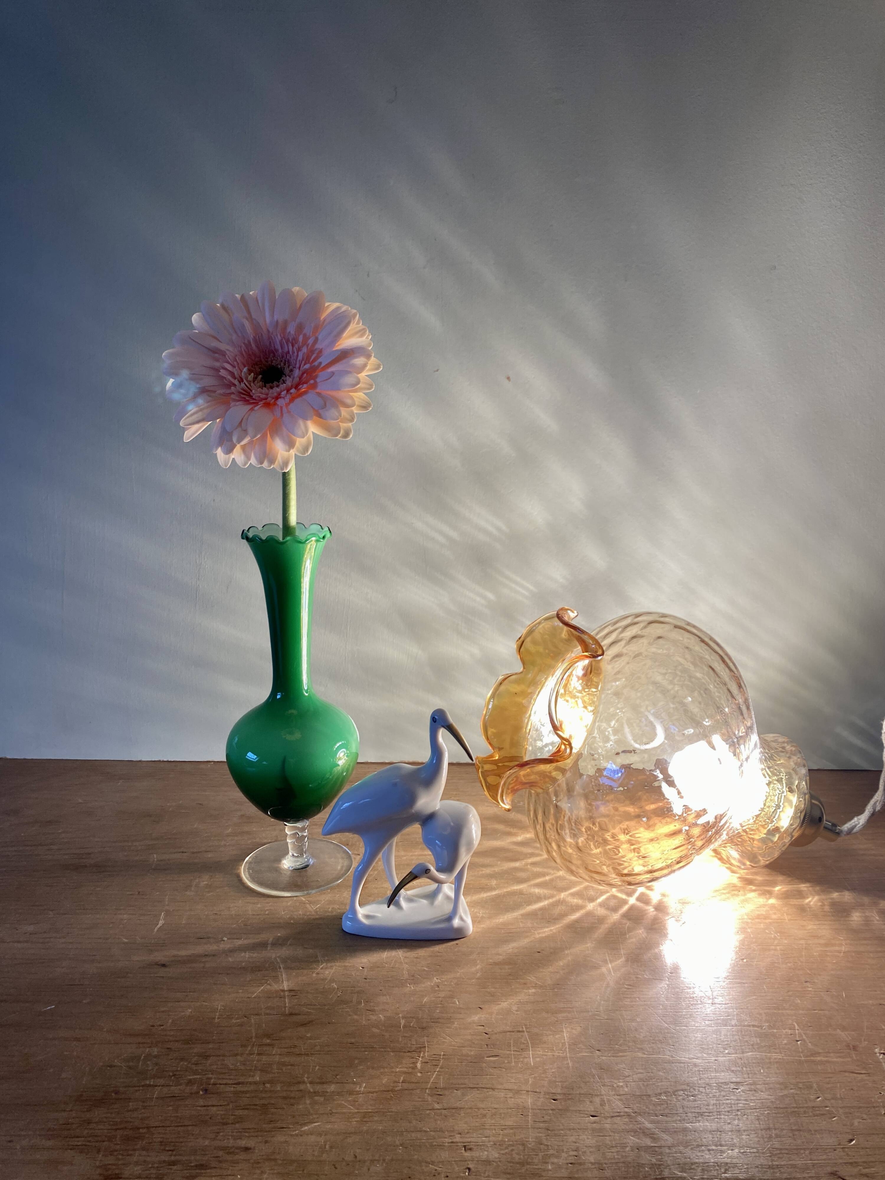 Vintage globe pendant light in amber glass