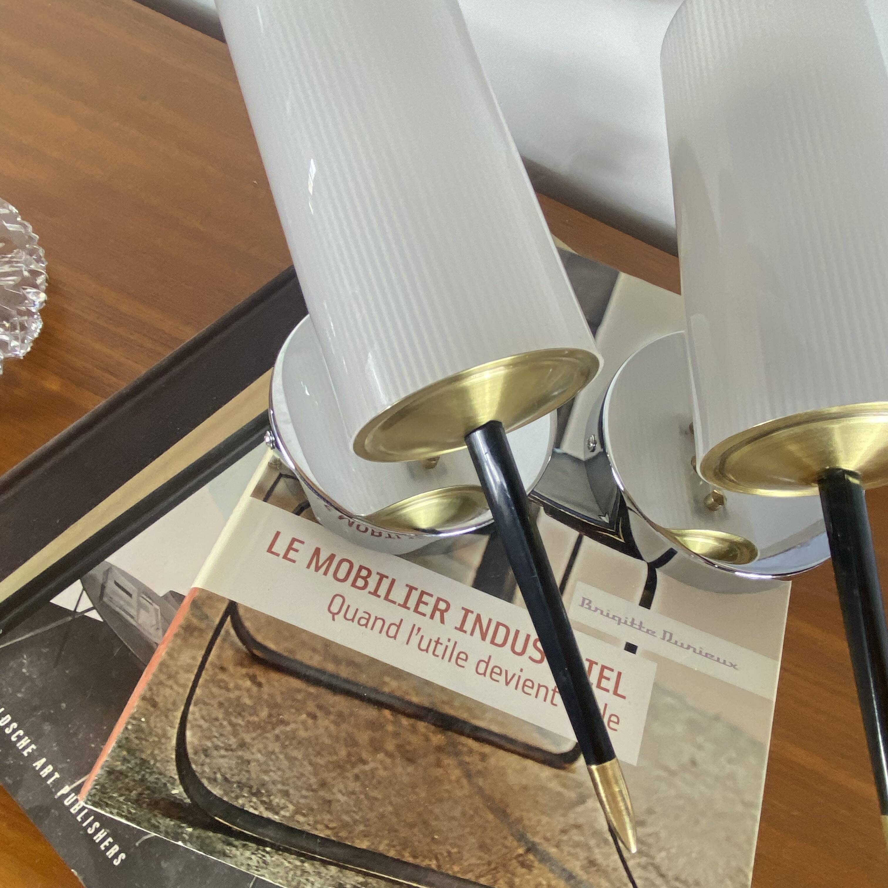Pair of vintage wall sconces in plexiglass plastic and brass.