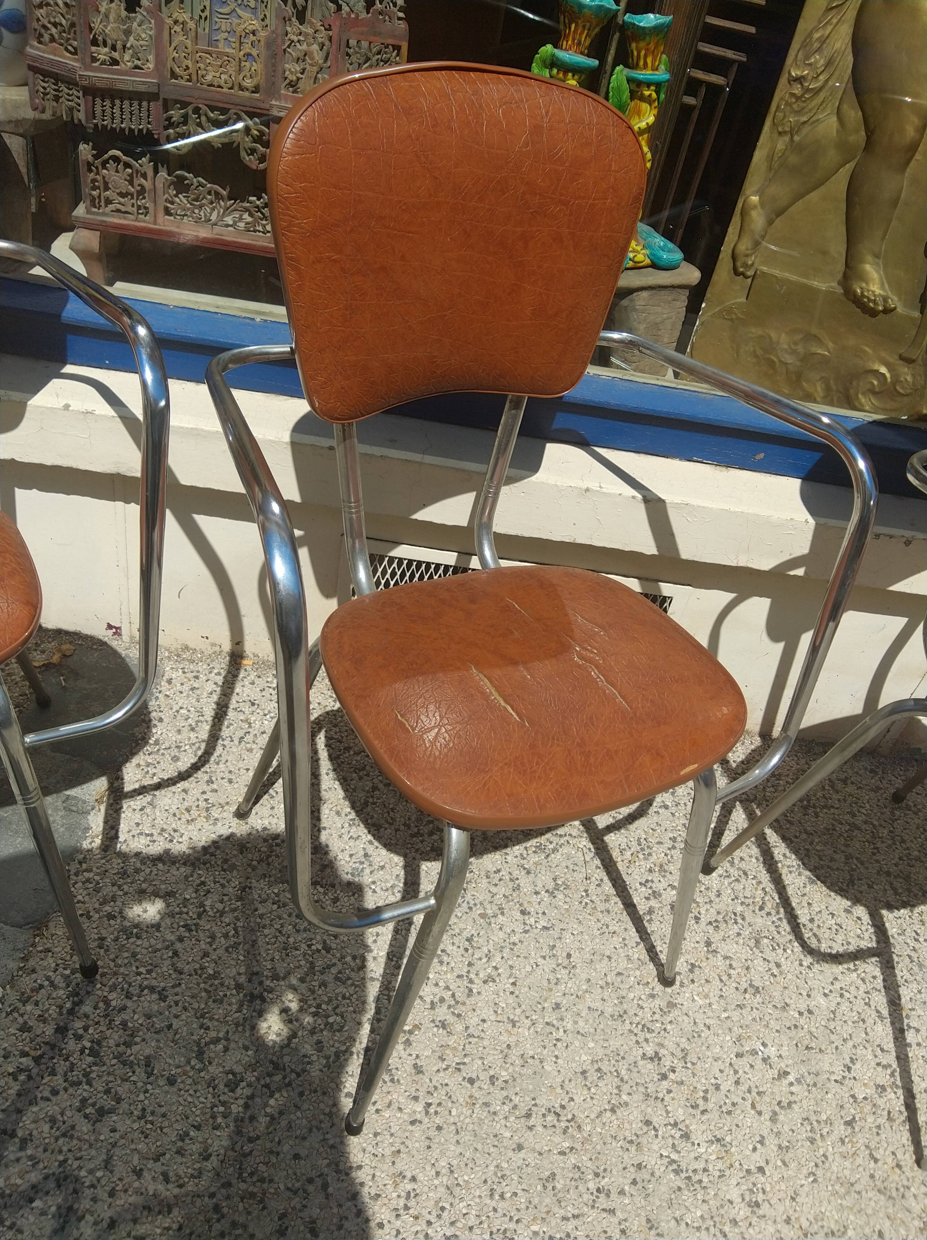 Set of 4 armchairs in chromed metal and brown imitation leather, circa 1960