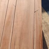 Low farmhouse table in raw wood